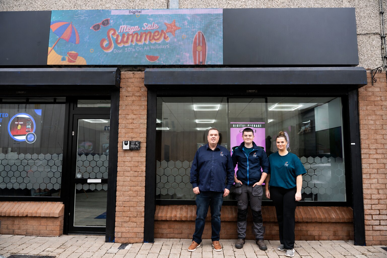 Raphael, Corey and Zoe outside the Digi Sign digital signage showroom